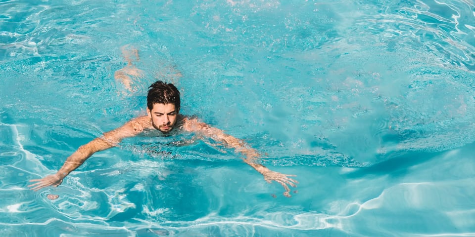 man-doing-breaststroke-swimming